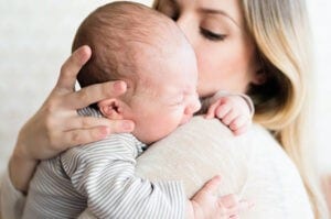 Colic baby in mother's arms